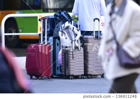 Tokyo cityscape in Japan Inbound tourism continues... suitcases... father keeps watch while mother and daughter leave their luggage and go somewhere = Shibuya Tokyo cityscape in Japan Inbound tourism continues... suitcases... father keeps watch while mother and daughter leave their luggage and go somewhere = Shibuya 136911248