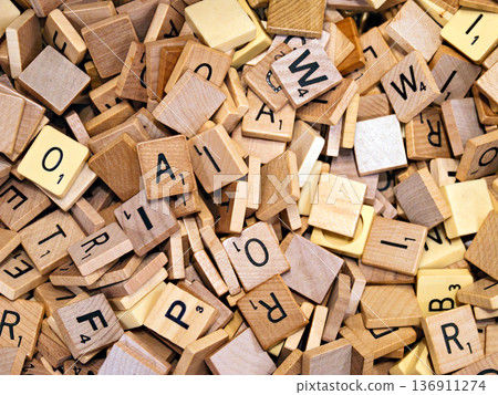 Abstract background. Wooden tiles with letters for the scrubble game Abstract background. Wooden tiles with letters for the scrubble game 136911274