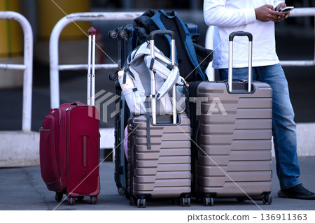 Tokyo cityscape in Japan Inbound tourism continues... suitcases... father keeps watch while mother and daughter leave their luggage and go somewhere = Shibuya 136911363