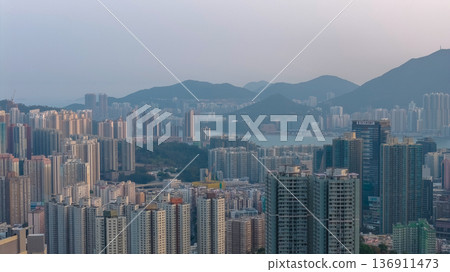 Dense Kwun Tong skyline framed by distant mountain backdrop Feb 19 2026 136911473