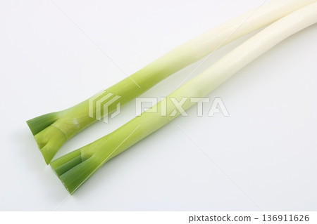 Green onions are a versatile vegetable that is essential in the kitchen. Green onions are a versatile vegetable that is essential in the kitchen. 136911626