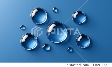 A close-up composition of transparent water droplets floating on a vibrant blue background, creating a sense of cleanliness and freshness 136911840