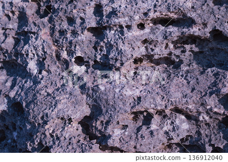 Natural stone surface texture for architectural background, solid rock material, gray mineral slab with rough grain and organic pattern details Natural stone surface texture for architectural background, solid rock material, gray mineral slab with rough grain and organic pattern details 136912040