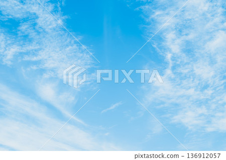 Panoramic view clear azure sky with wispy cirrus clouds. Soft blue gradients airy textures create vast minimalist backdrop with extensive copyspace 136912057
