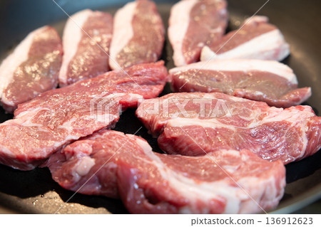Delicious lamb cooked in a frying pan Delicious lamb cooked in a frying pan 136912623