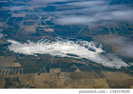 Gualicho Salted lake peninsula valdes aerial view panorama from airplane window. The Salinas del Gualicho are a vast expanse of salt located near Las Grutas, located about 70 meters below sea level. 136914080