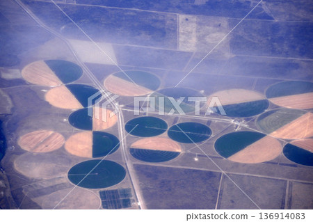 Agriculture circular irrigation circles aerial view in peninsula valdes panorama from airplane window Agriculture circular irrigation circles aerial view in peninsula valdes panorama from airplane window 136914083