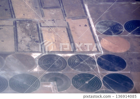 Agriculture circular irrigation circles aerial view in peninsula valdes panorama from airplane window Agriculture circular irrigation circles aerial view in peninsula valdes panorama from airplane window 136914085