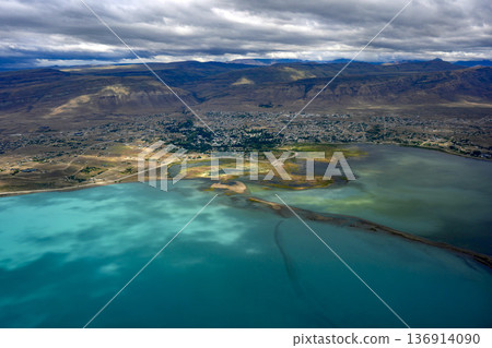 el calafate town and argentinian turquoise lake view from aerial from airplane window 136914090