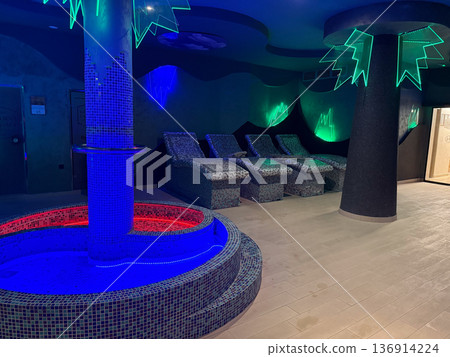 Spa relaxation area with mosaic loungers and neon accent lighting. Wellness leisure, body recovery and modern resort interior 136914224