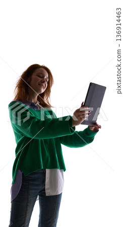 Young woman taking selfie with tablet isolated on white background. Young woman taking selfie with tablet isolated on white background. 136914463
