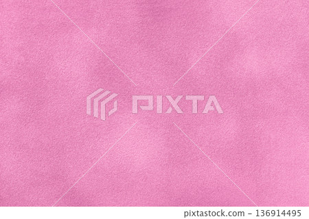 Pink suede fabric background with matte nap velvet texture. Light purple tones and soft felt textile surface in macro 136914495