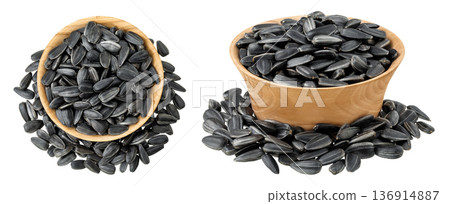 Sunflower seeds in wooden bowl isolated on white background. Top view. Flat lay 136914887