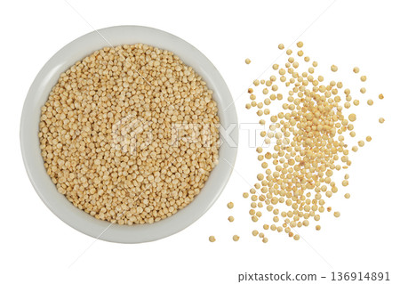 white quinoa seeds in ceramic bowl as a background. Top view. Flat lay white quinoa seeds in ceramic bowl as a background. Top view. Flat lay 136914891