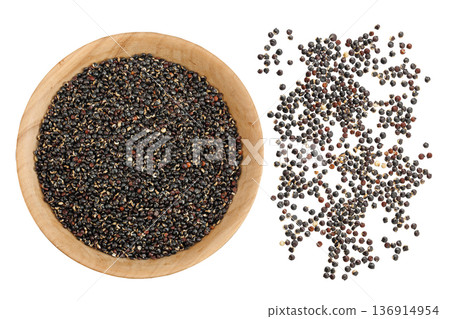 black quinoa in wooden bowl as a background. Top view. Flat lay 136914954