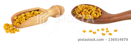 Bee pollen grains in wooden spoon and scoop isolated on white background 136914979