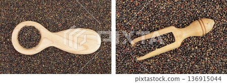black quinoa in wooden spoon and scoop as a background. Top view. Flat lay 136915044