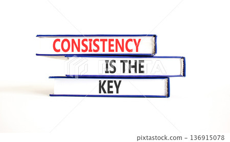 Consistency is the key symbol. Concept words Consistency is the key on beautiful books. Beautiful white paper background. Business consistency is the key concept. Copy space. 136915078