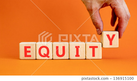 Equity support and help symbol. Concept word Equity on beautiful wooden blocks. Beautiful orange background. Psychologist's hand. Business equity support and help concept. Copy space. 136915100