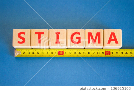 Stigma word symbol. Concept word Stigma on beautiful wooden blocks. Beautiful blue background. Beautiful yellow tape measure ruler. Business psychological stigma word concept. Copy space. Stigma word symbol. Concept word Stigma on beautiful wooden blocks. Beautiful blue background. Beautiful yellow tape measure ruler. Business psychological stigma word concept. Copy space. 136915103