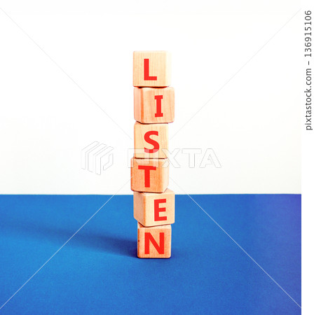 Listen symbol. Concept word Listen on beautiful wooden blocks. Beautiful blue and white background. Business education listen concept. Copy space. 136915106