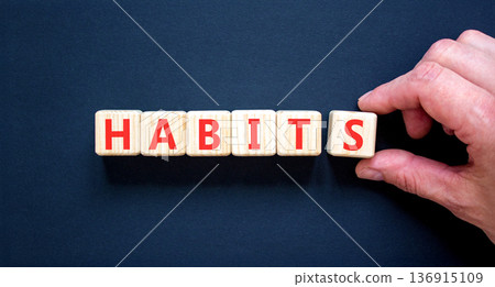 Habits support and help symbol. Concept word Habits on beautiful wooden blocks. Beautiful black background. Psychologist's hand. Business psychological habits support and help concept. Copy space. Habits support and help symbol. Concept word Habits on beautiful wooden blocks. Beautiful black background. Psychologist's hand. Business psychological habits support and help concept. Copy space. 136915109