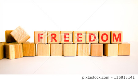 Freedom support symbol. Concept word Freedom on beautiful wooden blocks. Beautiful white background. Business freedom support concept. Copy space. 136915141