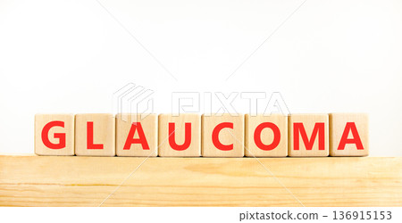 Glaucoma word symbol. Concept word Glaucoma on beautiful wooden blocks on wooden beam. Beautiful white background. Medical support help glaucoma word concept. Copy space. Glaucoma word symbol. Concept word Glaucoma on beautiful wooden blocks on wooden beam. Beautiful white background. Medical support help glaucoma word concept. Copy space. 136915153