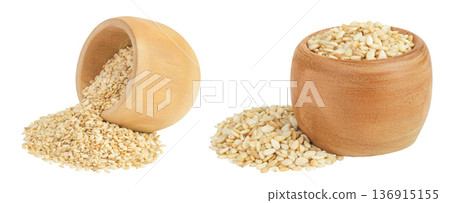 Sesame seeds in wooden bowl isolated on white background Sesame seeds in wooden bowl isolated on white background 136915155