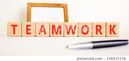 Teamwork word symbol. Concept word Teamwork on beautiful wooden blocks. Beautiful white background. Beautiful black pen. Business support help teamwork word concept. Copy space. Teamwork word symbol. Concept word Teamwork on beautiful wooden blocks. Beautiful white background. Beautiful black pen. Business support help teamwork word concept. Copy space. 136915156