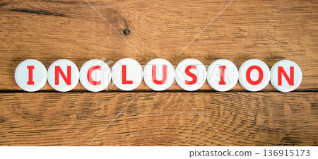 Inclusion symbol. Concept words Inclusion on beautiful white circles. Beautiful wooden background. Business support inclusion concept. Copy space. 136915173