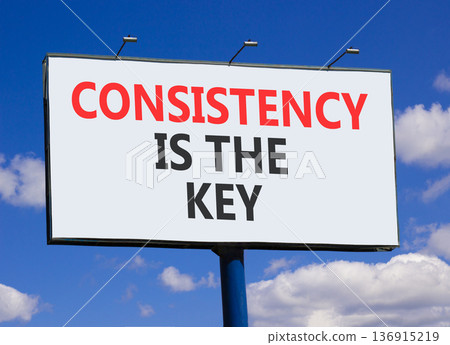 Consistency is the key symbol. Concept words Consistency is the key on beautiful big white billboard. Beautiful blue sky background. Business consistency is the key concept. Copy space. 136915219