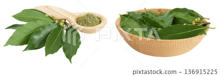 Fresh and ground Laurel leaves in wooden spoon and bowl isolated on white background. Green bay leaf 136915225