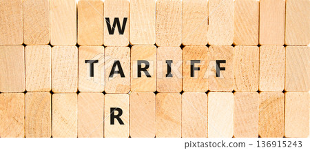 Trade tariff war symbol. Concept word Tariff war on beautiful wooden block wall. Beautiful wooden block wall background. Wooden blocks. Business trade tariff wars concept. Copy space. Trade tariff war symbol. Concept word Tariff war on beautiful wooden block wall. Beautiful wooden block wall background. Wooden blocks. Business trade tariff wars concept. Copy space. 136915243