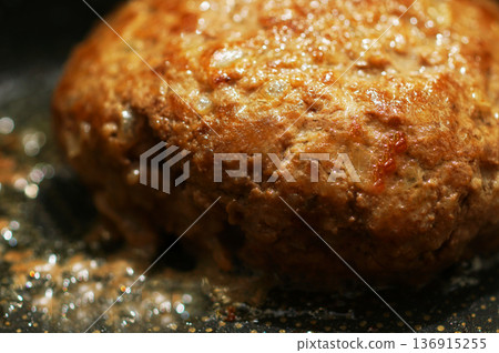 Cooking hand-made hamburger steak in a frying pan 136915255