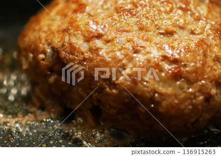Cooking hand-made hamburger steak in a frying pan 136915263
