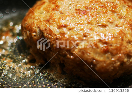 Cooking hand-made hamburger steak in a frying pan 136915266