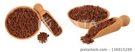 Dark muscovado sugar or Barbados sugar in wooden bowl isolated on white background. Top view. Flat lay Dark muscovado sugar or Barbados sugar in wooden bowl isolated on white background. Top view. Flat lay 136915289