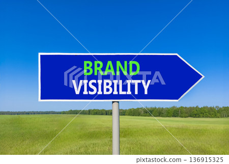 Brand visibility symbol. Concept words Brand visibility on beautiful blue road sign. Beautiful blue sky green grass field background. Business branding and brand visibility concept. Copy space. 136915325