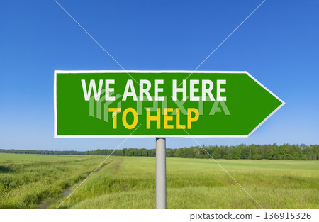 Support, help and we are here to help symbol. Concept words We are here to help on beautiful green road sign. Beautiful blue sky field background. Business we are here to help concept. Copy space. 136915326