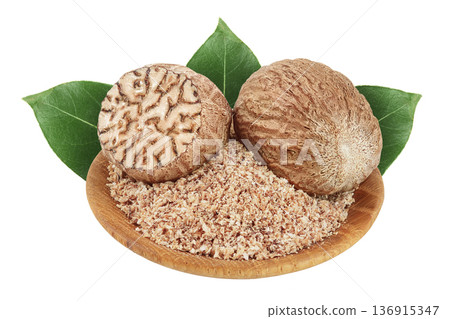 Whole and grated nutmeg in wooden bowl isolated on white background with full depth of field. 136915347