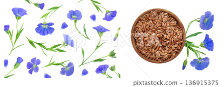 flax seeds in wooden bowl with flower isolated on white background flax seeds in wooden bowl with flower isolated on white background 136915375