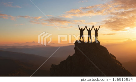 Team of people celebrating success on mountain peak at sunrise Team of people celebrating success on mountain peak at sunrise 136915934