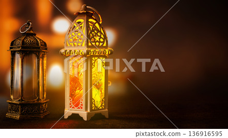 Two decorative Arabic lanterns with intricate patterns glowing warmly against a dark, out-of-focus background. Ideal for Ramadan, Eid al-Fitr, and Islamic holiday themes Two decorative Arabic lanterns with intricate patterns glowing warmly against a dark, out-of-focus background. Ideal for Ramadan, Eid al-Fitr, and Islamic holiday themes 136916595
