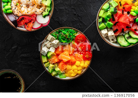Poke bowl assortment. Rice with salmon, shrimps, and grapefruit 136917056