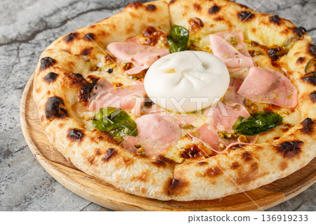 Authentic Italian pizza with mortadella sausage and burrata cheese, close-up, on a wooden board. Horizontal Authentic Italian pizza with mortadella sausage and burrata cheese, close-up, on a wooden board. Horizontal 136919233