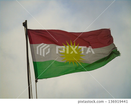 The flag of Kurdistan fliutters in the wind in Erbil, Iraq 136919441