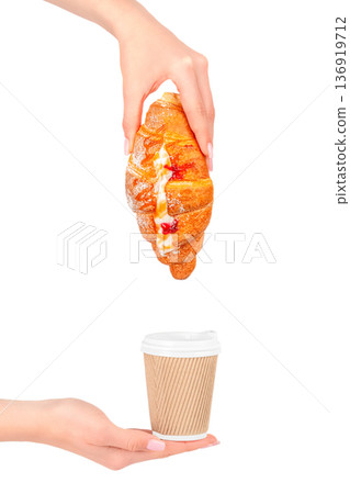 Sweet croissant with cream and jam over takeaway coffee Sweet croissant with cream and jam over takeaway coffee 136919712