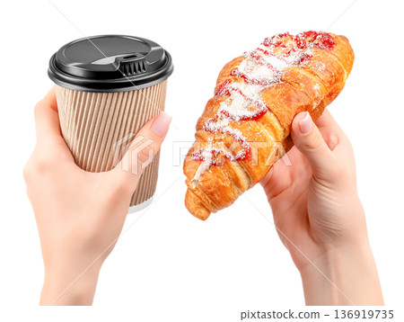 Takeaway coffee cup and sweet croissant with berry topping in hands isolated on white 136919735