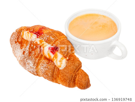 Cream filled croissant with berry and caramel near cappuccino cup Cream filled croissant with berry and caramel near cappuccino cup 136919748